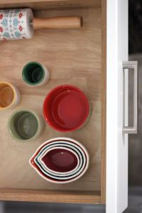 measuring cups, rolling pin